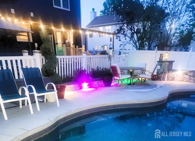 view of pool with a patio, fence, and a fenced in pool