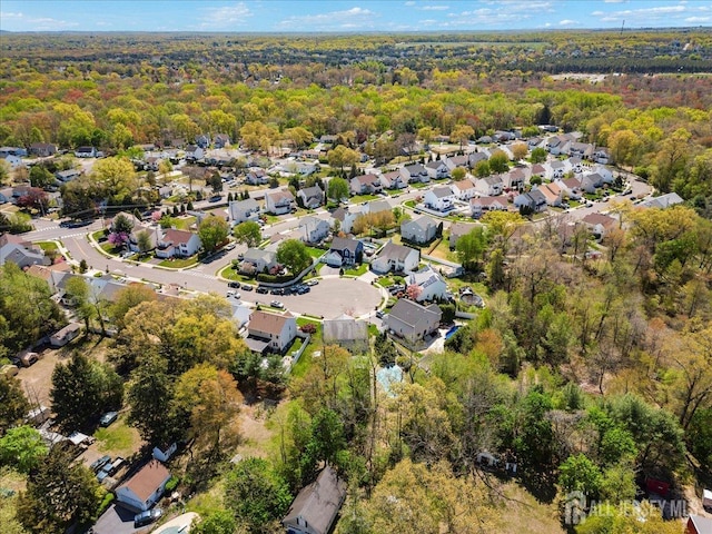 aerial view with a residential view and a wooded view