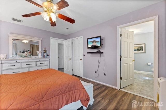 bedroom with baseboards, ceiling fan, wood finished floors, and visible vents