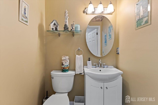 bathroom featuring vanity and toilet