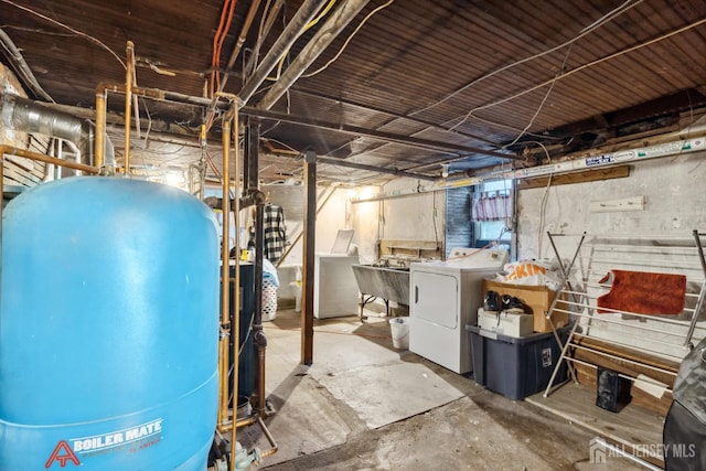 basement featuring sink and independent washer and dryer