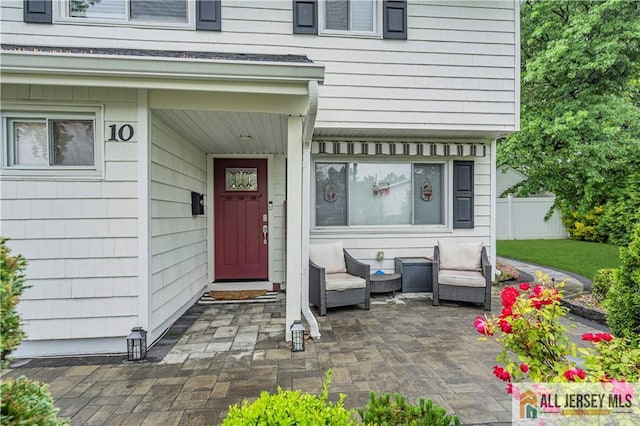10 Buttonwood Dr, Old Bridge, NJ 08857 - entrance to property with a patio area
