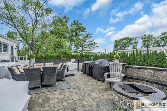 10 Buttonwood Dr, Old Bridge, NJ 08857 - fenced backyard featuring outdoor dining space and a patio area