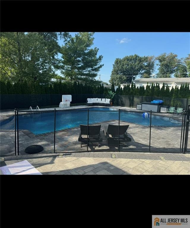 10 Buttonwood Dr, Old Bridge, NJ 08857 - view of pool featuring a patio area