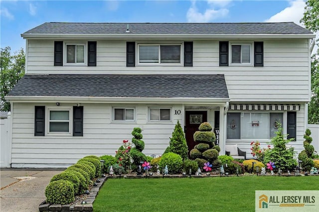10 Buttonwood Dr, Old Bridge, NJ 08857 - view of front of property featuring a front yard