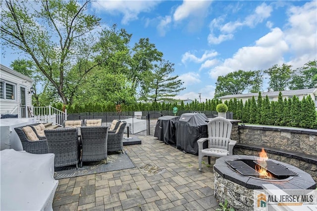 10 Buttonwood Dr, Old Bridge, NJ 08857 - view of patio with an outdoor fire pit and outdoor dining space