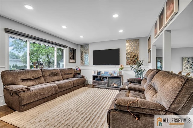10 Buttonwood Dr, Old Bridge, NJ 08857 - living area featuring a decorative wall, wood finished floors, recessed lighting, and a wainscoted wall