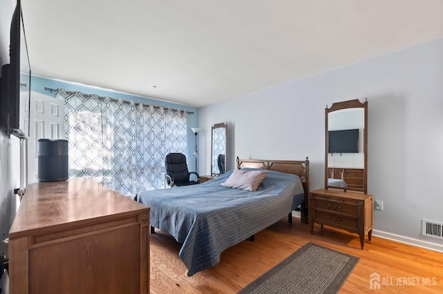 bedroom featuring light hardwood / wood-style floors