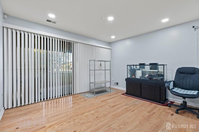 office with light wood-type flooring