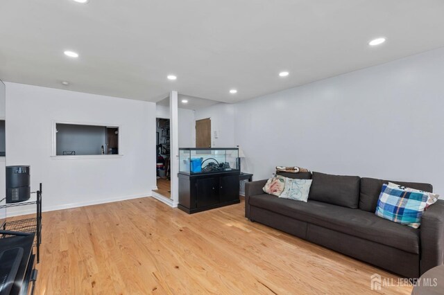 living room with light hardwood / wood-style flooring