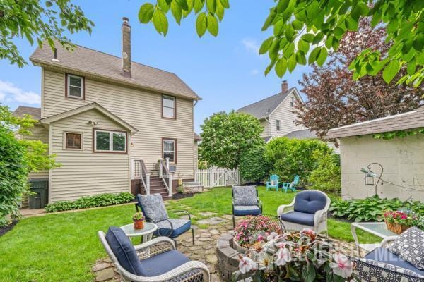 185 Rowland Pl, Woodbridge Proper, NJ 07095 - back of house featuring a patio and a chimney
