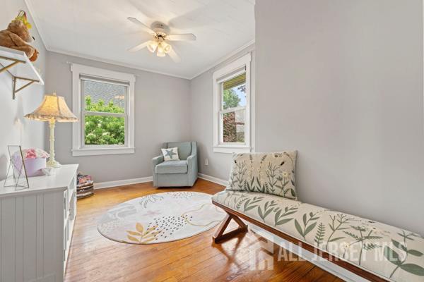 185 Rowland Pl, Woodbridge Proper, NJ 07095 - sitting room featuring crown molding and wood finished floors