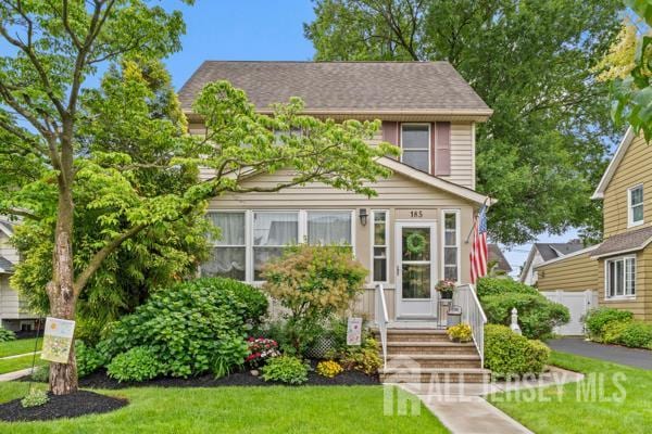 185 Rowland Pl, Woodbridge Proper, NJ 07095 - view of front of house with a front lawn