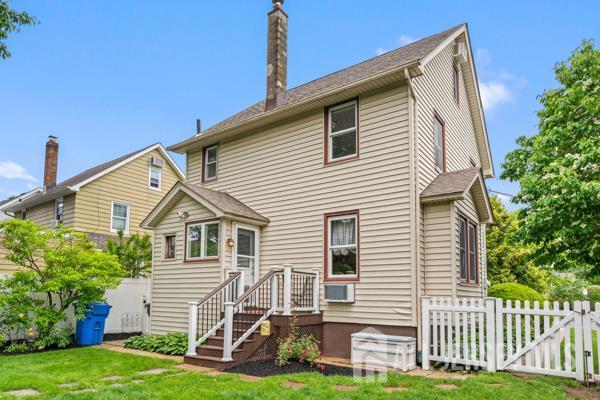 185 Rowland Pl, Woodbridge Proper, NJ 07095 - rear view of property featuring a chimney and cooling unit
