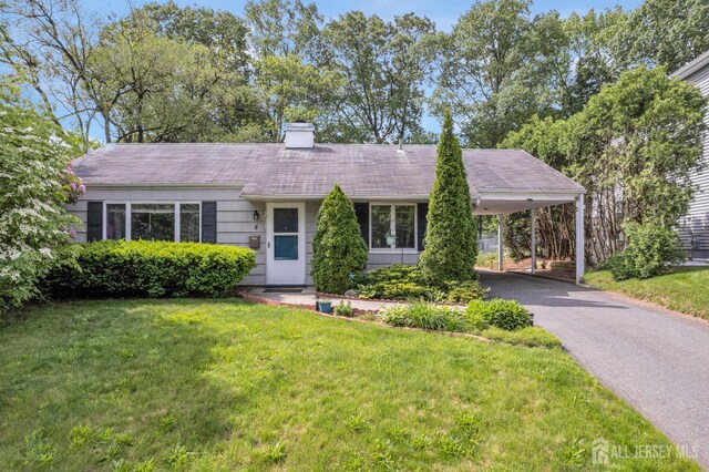 4 Dayton Rd, Edison, NJ 08817 - ranch-style house with a front yard, a chimney, asphalt driveway, and an attached carport
