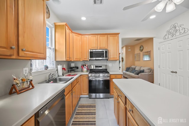 4 Holly Manor Ct, Helmetta, NJ 08828 - kitchen with stainless steel appliances, light countertops, light tile patterned flooring, a ceiling fan, and recessed lighting