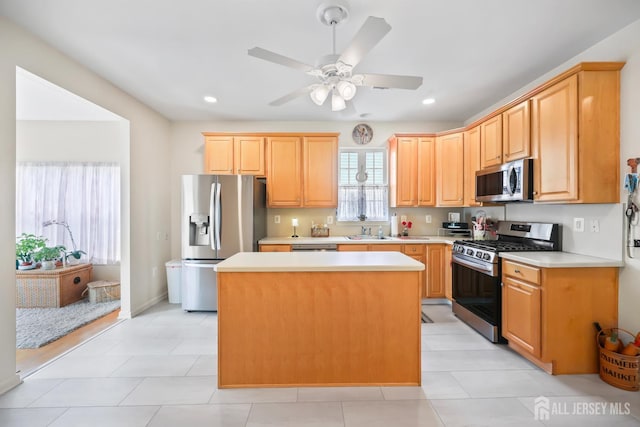 4 Holly Manor Ct, Helmetta, NJ 08828 - kitchen with stainless steel appliances, a center island, light countertops, a ceiling fan, and recessed lighting