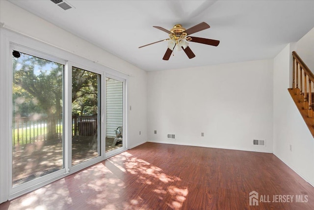 450 Saint Giles Ct, Franklin Twsp, NJ 08873 - spare room featuring wood finished floors, stairway, a ceiling fan, and baseboards
