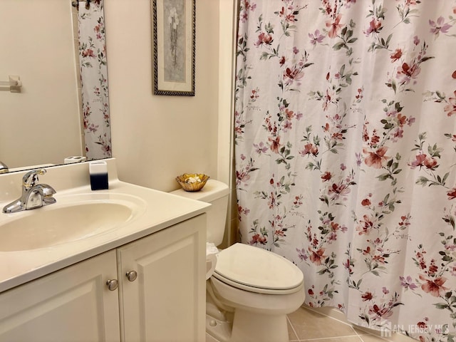 full bathroom with tile patterned floors, toilet, a shower with curtain, and vanity