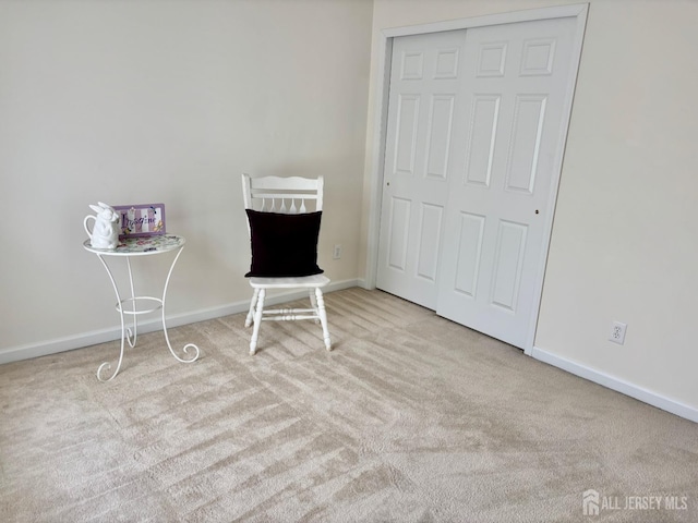 bedroom with baseboards and carpet