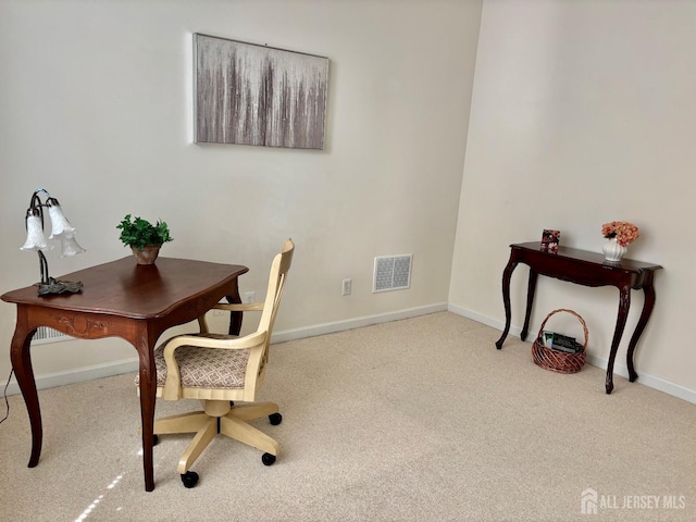 home office with baseboards, visible vents, and carpet