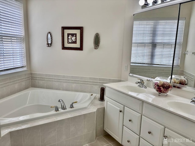 full bath featuring double vanity, a bath, and a sink