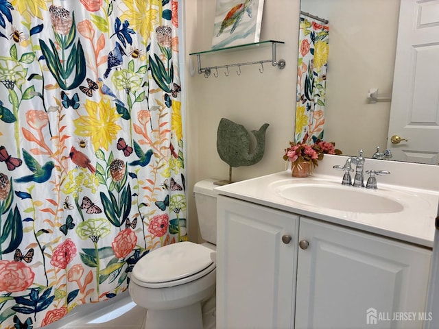 bathroom with vanity, toilet, and a shower with curtain