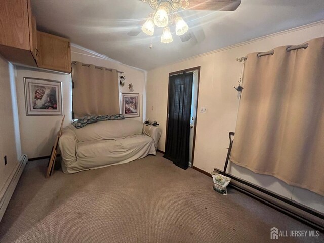 carpeted bedroom with ceiling fan and a baseboard radiator