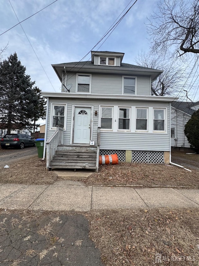 traditional style home featuring entry steps