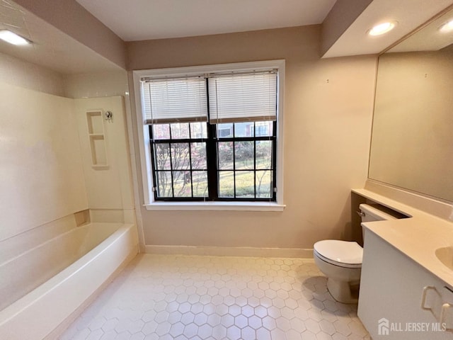 full bathroom featuring  shower combination, toilet, baseboards, tile patterned flooring, and vanity