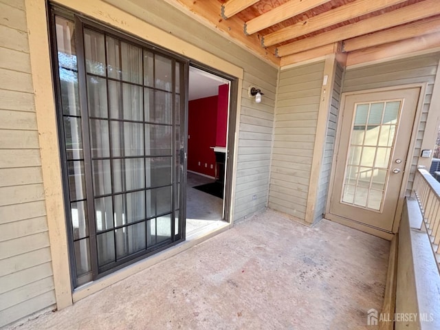 entrance to property featuring a balcony