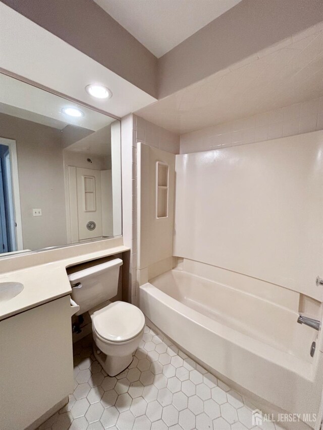 full bathroom featuring tile patterned floors, shower / bathing tub combination, vanity, and toilet