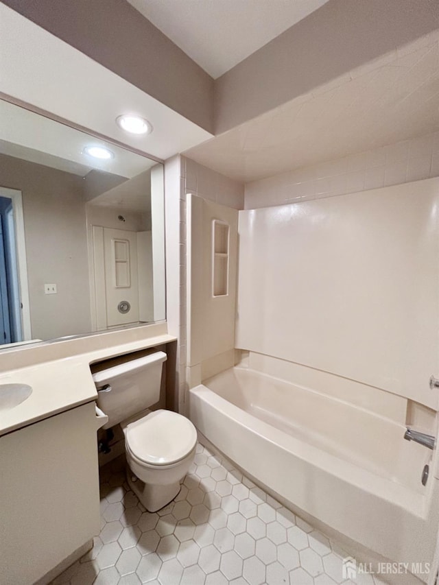 bathroom with toilet, shower / bathing tub combination, recessed lighting, tile patterned flooring, and vanity