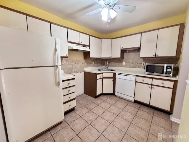 kitchen with white cabinetry, sink, backsplash, ceiling fan, and white appliances