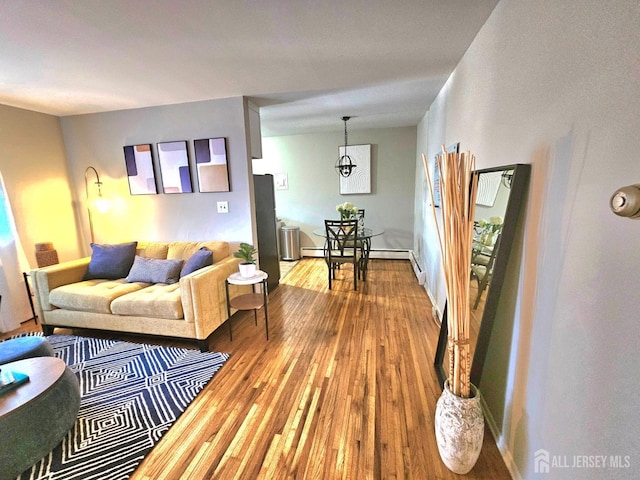 living room with baseboards and hardwood / wood-style floors