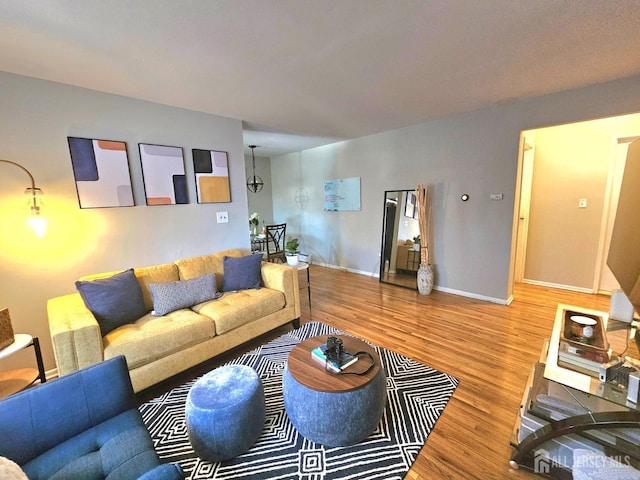 living room featuring baseboards and wood finished floors