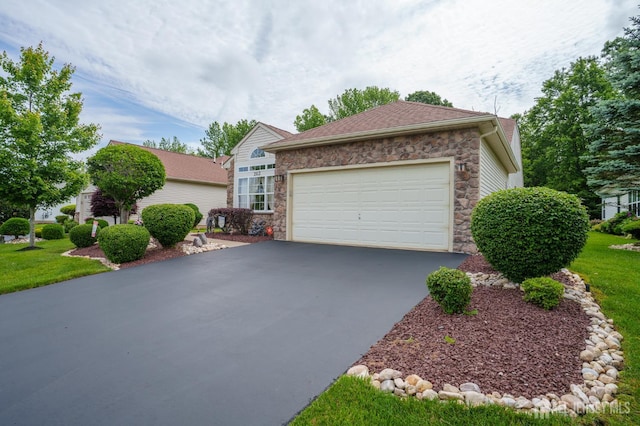 263 Valencia Dr, Monroe, NJ 08831 - view of front of property featuring stone siding, driveway, a garage, and a front yard