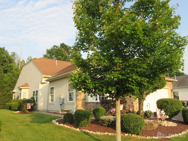 263 Valencia Dr, Monroe, NJ 08831 - view of property hidden behind natural elements featuring a front lawn and stone siding
