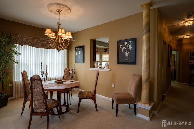 263 Valencia Dr, Monroe, NJ 08831 - dining area featuring light carpet, ornate columns, and a chandelier