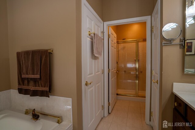 263 Valencia Dr, Monroe, NJ 08831 - bathroom featuring vanity, a stall shower, a bath, and tile patterned floors