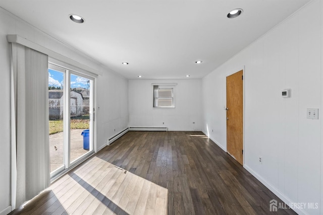 unfurnished room featuring wood-type flooring, baseboards, and recessed lighting