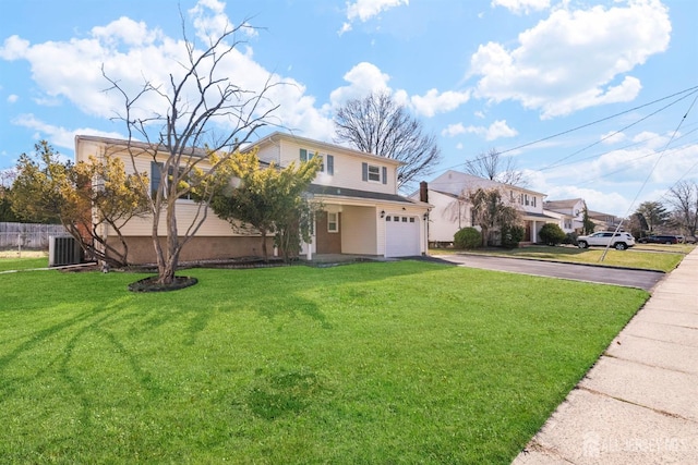 view of front of house featuring asphalt driveway and central AC unit