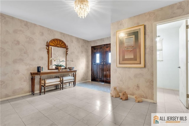 entryway featuring light tile patterned floors, wallpapered walls, and baseboards