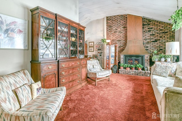 sitting room with a fireplace, carpet, and lofted ceiling