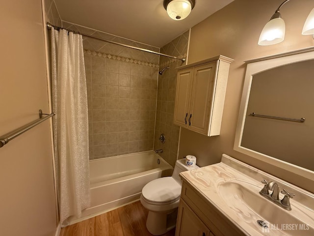 full bath with vanity, shower / bathtub combination with curtain, toilet, and wood finished floors