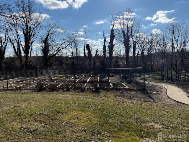 view of yard featuring fence and a rural view