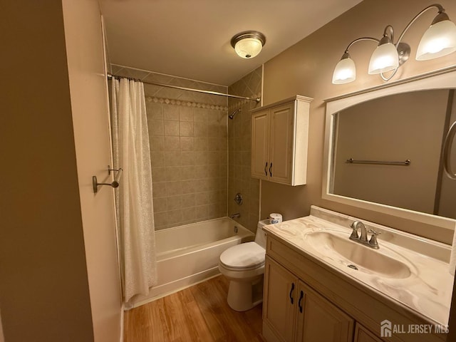 bathroom with shower / bath combination with curtain, vanity, toilet, and wood finished floors