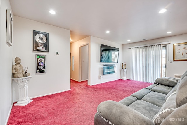 carpeted living room featuring heating unit