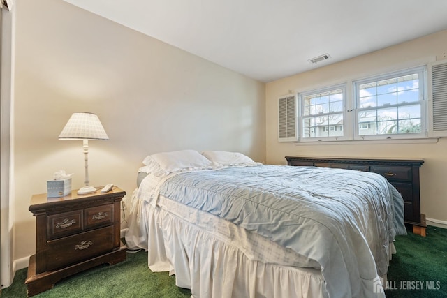 bedroom featuring baseboards, visible vents, and dark carpet