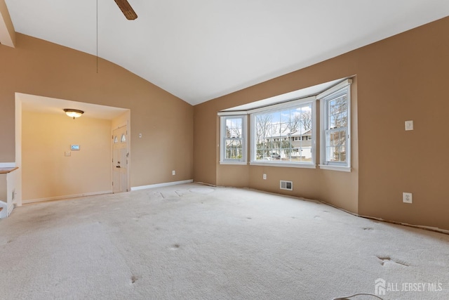 unfurnished living room with visible vents, light colored carpet, high vaulted ceiling, and ceiling fan